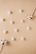 couple of cotton flowers on wooden background 