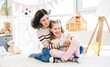 © Ievgen Skrypko - Happy mother with daughter having fun in cozy kids room