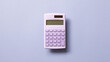 Purple digital calculator isolated on purple background. top view, copy space