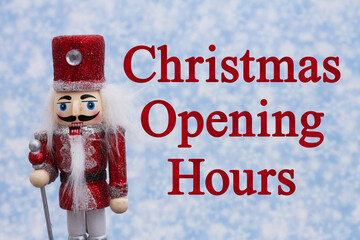 Wall Mural - Christmas Opening Hours message with happy nutcracker with hat