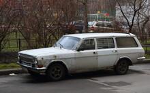 An Old Rusty Soviet Car At The Entrance Of A Residential Building, Iskrovsky Prospekt, Saint Petersburg, Russia, November 2021