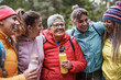 © Sabrina - Happy multiracial women with different generation having fun during trekking day into the woods