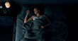 © Owl-vision-studio - Top view of beautiful young woman sleeping cozily in bed. Lady lying sound asleep at night. Loft interior.