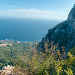 Wall Mural - view from one of the peaks of the Caucasus Mountains to the resort town on the Black Sea coast