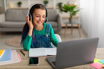 Poster - Girl using personal computer, wearing wireless headset