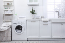 Kitchen Interior With Washing Machine And Stylish Furniture