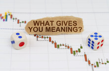 On The Trading Charts, There Are Dice And Pieces Of Paper With The Inscription - WHAT GIVES YOU MEANING