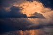 The big powerful storm clouds before a thunderstorm at sunset