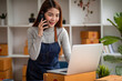 © David - Portrait of Asian young woman SME working with a box at home the workplace.start-up small business owner, small business entrepreneur SME or freelance business online and delivery concept.