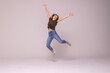 © F8  \ Suport Ukraine - Portrait of a cheerful cute woman jumping on a white background