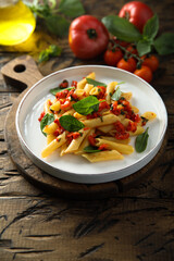 Wall Mural - Traditional Italian pasta with tomatoes and basil