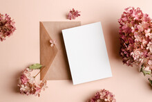 Wedding Invitation Or Greeting Card Mockup With Envelope And Pink Hydrangea Flowers Decorations.