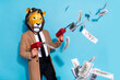 © deagreez - Profile side photo of weird creative lion character man shoot money jackpot credit pistol isolated over blue color background