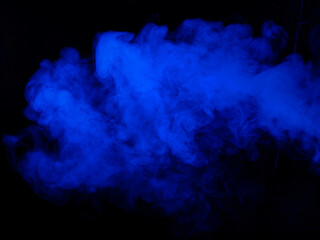 Wall Mural - Blue smoke texture on black background