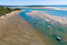 Aerial View Of Boats At Anchor In An Estuary At The Town Of 1770, QLD.