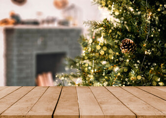 Wall Mural - empty christmas table background with christmas tree out of focus for product display montage.