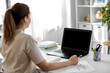 © Syda Productions - distant education, remote job and people concept - female math teacher with laptop computer and earphones working at home office