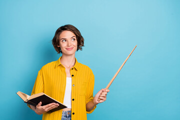 Photo of nice young brunette lady hold book wear yellow shirt isolated on blue color background