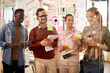 © Drazen - Multiracial start-up team cooperates while creating mind map on glass wall in office.