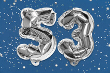 Silver Foil Balloon Number, Digit Fifty Three On A Blue Background With Sequins. Birthday Greeting Card With Inscription 53. Top View. Numerical Digit. Celebration Event, Template.