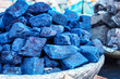 Blue indigo color stones displayed at traditional souk - street market in Marrakech, Morocco, closeup detail