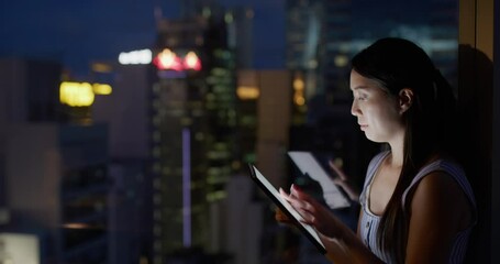 Wall Mural - Woman read on tablet computer at night