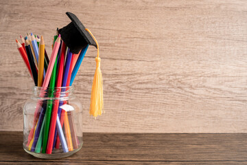 Wall Mural - Graduation hat with colorful pencils with copy space, learning university education concept.