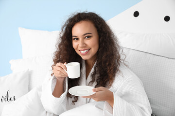 Poster - Morning of young woman drinking coffee in bed