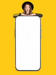 Poster - Woman smartphone big. Girls demonstrate gadget on yellow background. Blank mobile phone. Mobile gadget with white screen. Phone number for your website. Lady leans on phone and looks at display