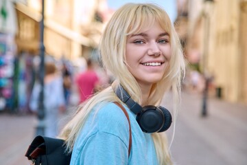 outdoor portrait of a happy smiling teenage girl 17 years old