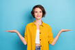 Photo of advertiser lady hands demonstrate empty space wear yellow shirt isolated blue color background