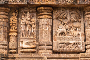 Wall Mural - Temple platform of Jagamohana carved with  erotic couples, young women flaunting their beauty in poses, nagas, vyalas, soldiers, elephants, court scenes Sun Temple Konark, Odisha, India.