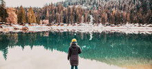 Woman Watchin Amazing Turquoise Water Of Caumasee In Winter Switzerland Slow Travel
