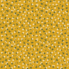 Wall Mural - Seamless floral pattern. Ditsy background of small white flowers. Vector pattern. Elegant template for fashion prints. Yellow mustard background. Summer and spring motifs.