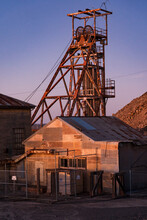 Abandoned Sheds And Poppet Head At A Mining Plant At Twilight