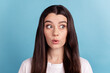 Photo of young pretty girl impressed look empty space wondered long hair isolated over blue color background