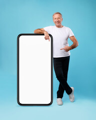 Poster - Man pointing at big white empty smartphone screen, mock-up