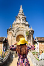 Tourist Woman Looking Wat Prathat Lampang Luang Temple, Thailand
