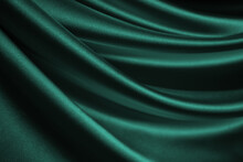 Blue Green Silk Satin. Soft, Wavy Folds. Shiny Fabric Surface. Luxurious Emerald Green Background With Copy Space For Design. Web Banner. Birthday, Christmas, Xmas, Valentine, Holiday, Concept.