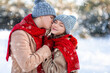 © Prostock-studio - Loving man kissing his pretty girlfriend while enjoyng snowy weekend
