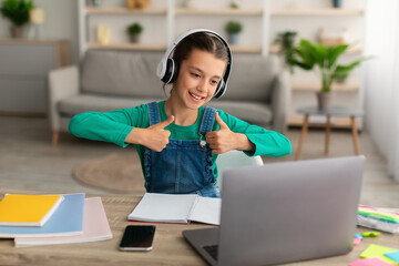 Poster - Girl sitting at desk, using personal computer, showing thumbs up