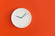 © LunaKate - White wall Clock on red background.