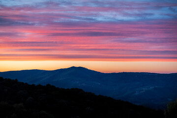 Wall Mural - Sunset dusk twilight and silhouette of Beech Mountain peak vibrant red dramatic color sky in North Carolina Blue Ridge Appalachias high angle view vista