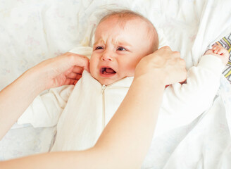 little cute baby toddler on carpet close up smiling, adorable kid