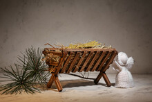 Manger With Angel On Light Background. Concept Of Christmas Story