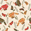 Winter holiday seamless pattern with sweater, knitting hat, sock and winter decorations. Christmas and New Year symbols.