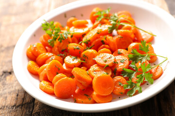 Sticker - fried carrot with parsley in plate