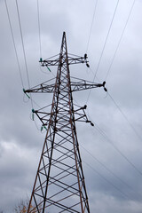 power line metal pilon  against the background of the autumn gloomy sky