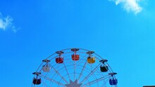 Low Angle View Of Ferris Wheel Against Blue Sky -  Barcelona