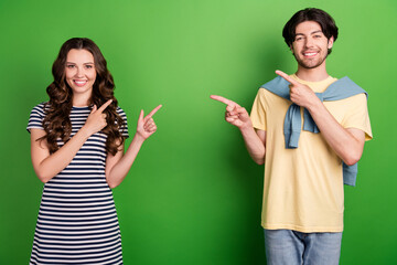 Canvas Print - Photo of young couple happy positive smile point fingers each other choice choose isolated over green color background